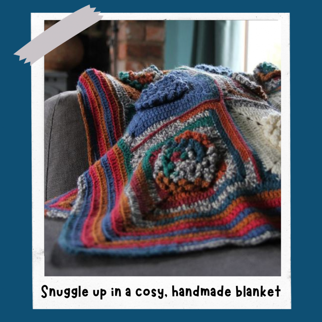 Crocheted blanket draped over a chair in a cosy room,