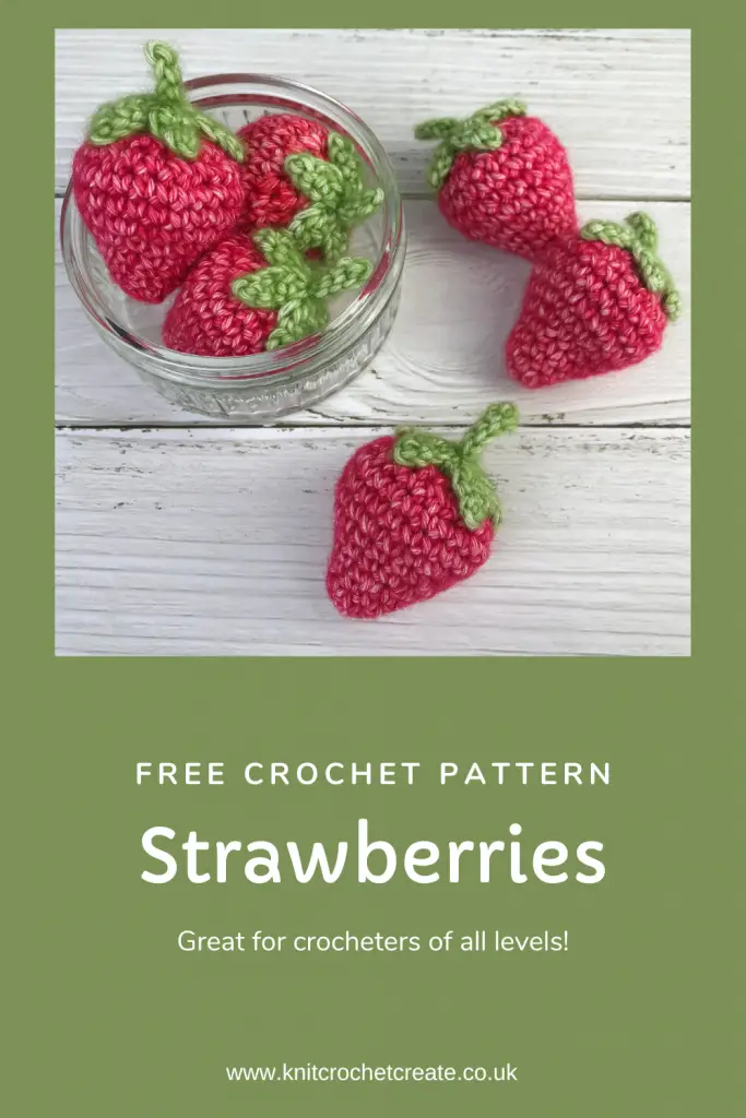 Pinterest pin showing handmade crochet strawberries in red yarn with green stems. 3 strawberries in pot and 3 scattered around, all made from my free crochet strawberry pattern