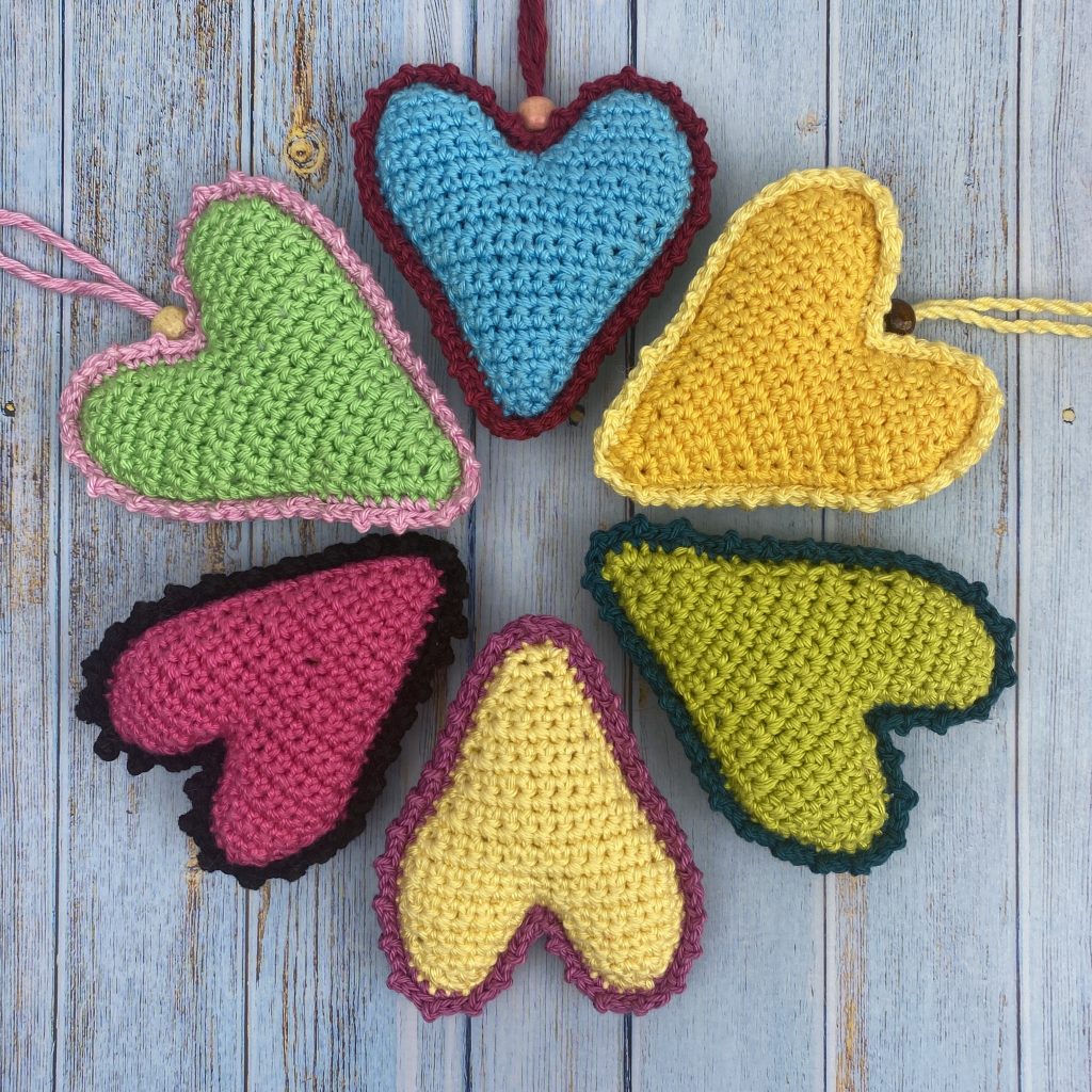 6 hearts in a circle made from free crochet heart pattern with hanging loops