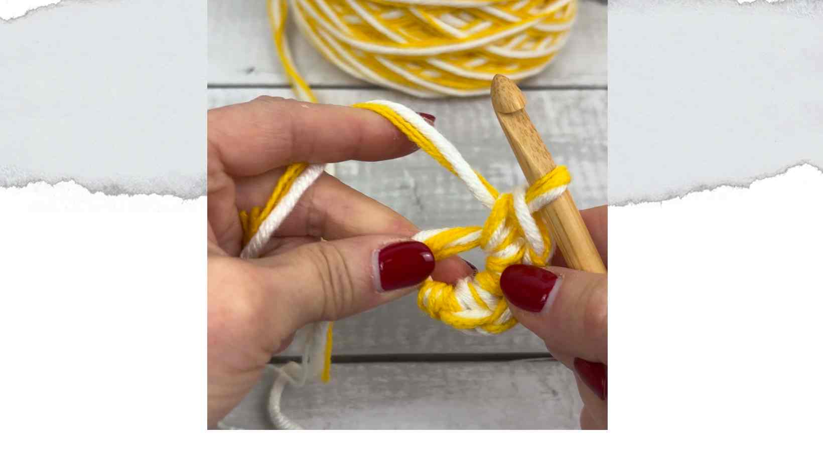 Hands crocheting with yarn held double