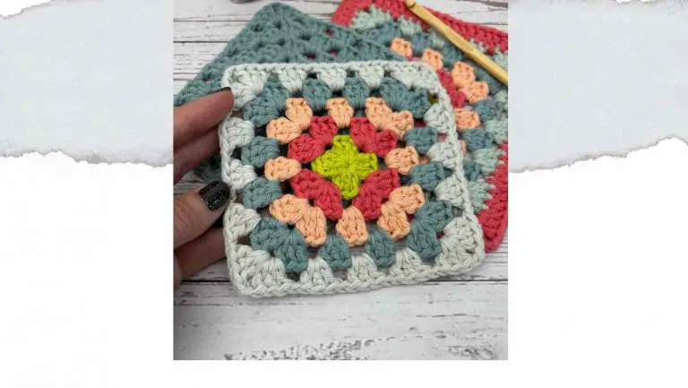 Hand holding a colourful Granny Square, made from free pattern