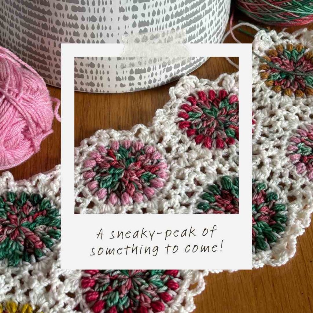 crochet project work in progress showing hexagon motifs joined with off-white yarn.