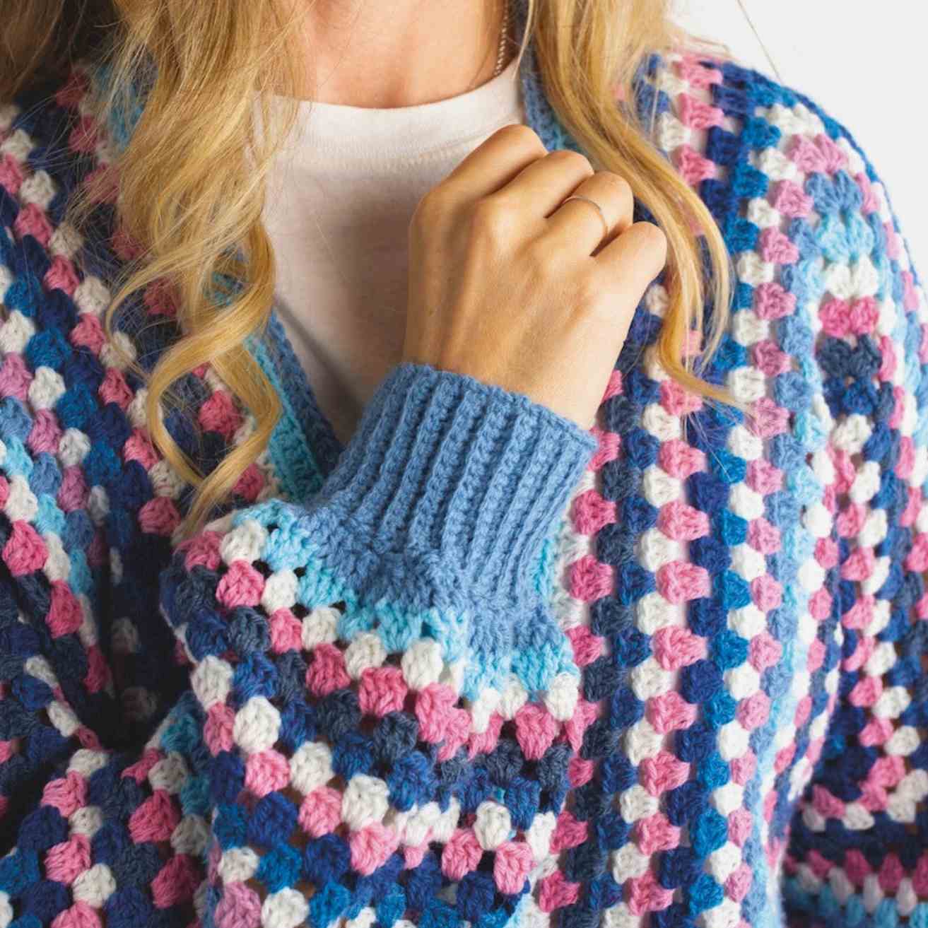 Showing ribbed cuffs of hexagon cardigan