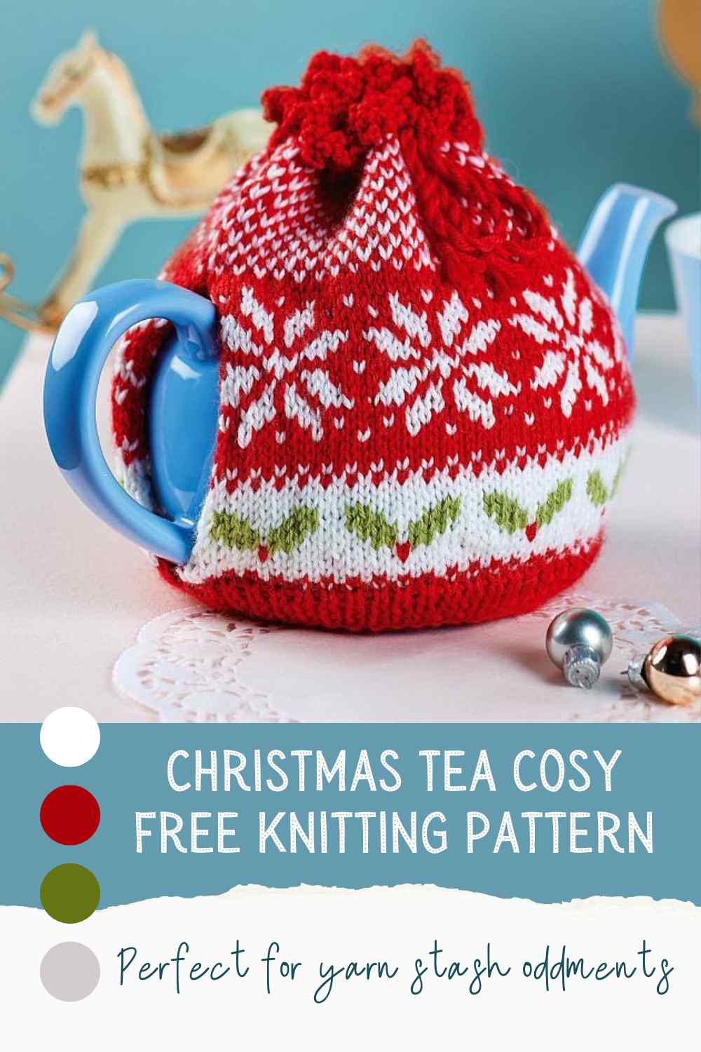 Knitted Tea Cosy in Red yarn with white snowflakes, made from free knitting pattern