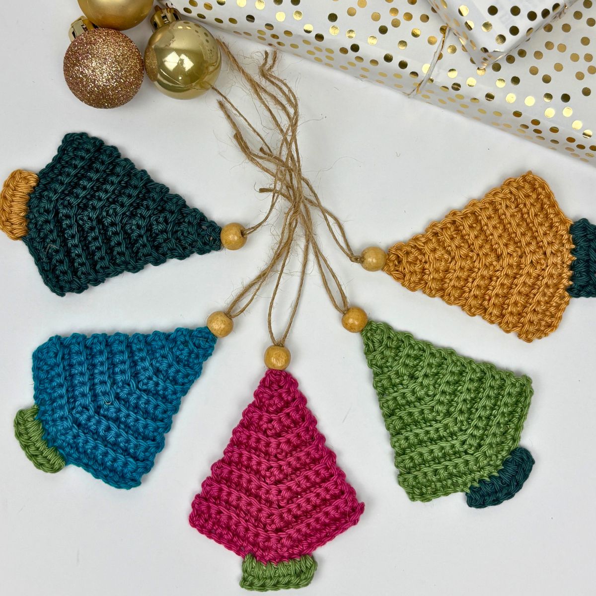 5 crochet Christmas trees with wooden bead and twine hanging loop for a rustic feel