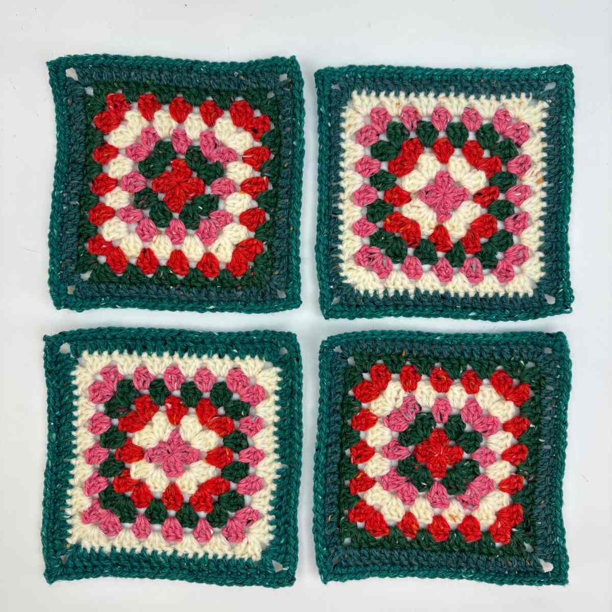 Crochet Granny Squares in festive colours ready to make crochet crossbody bag from free pattern