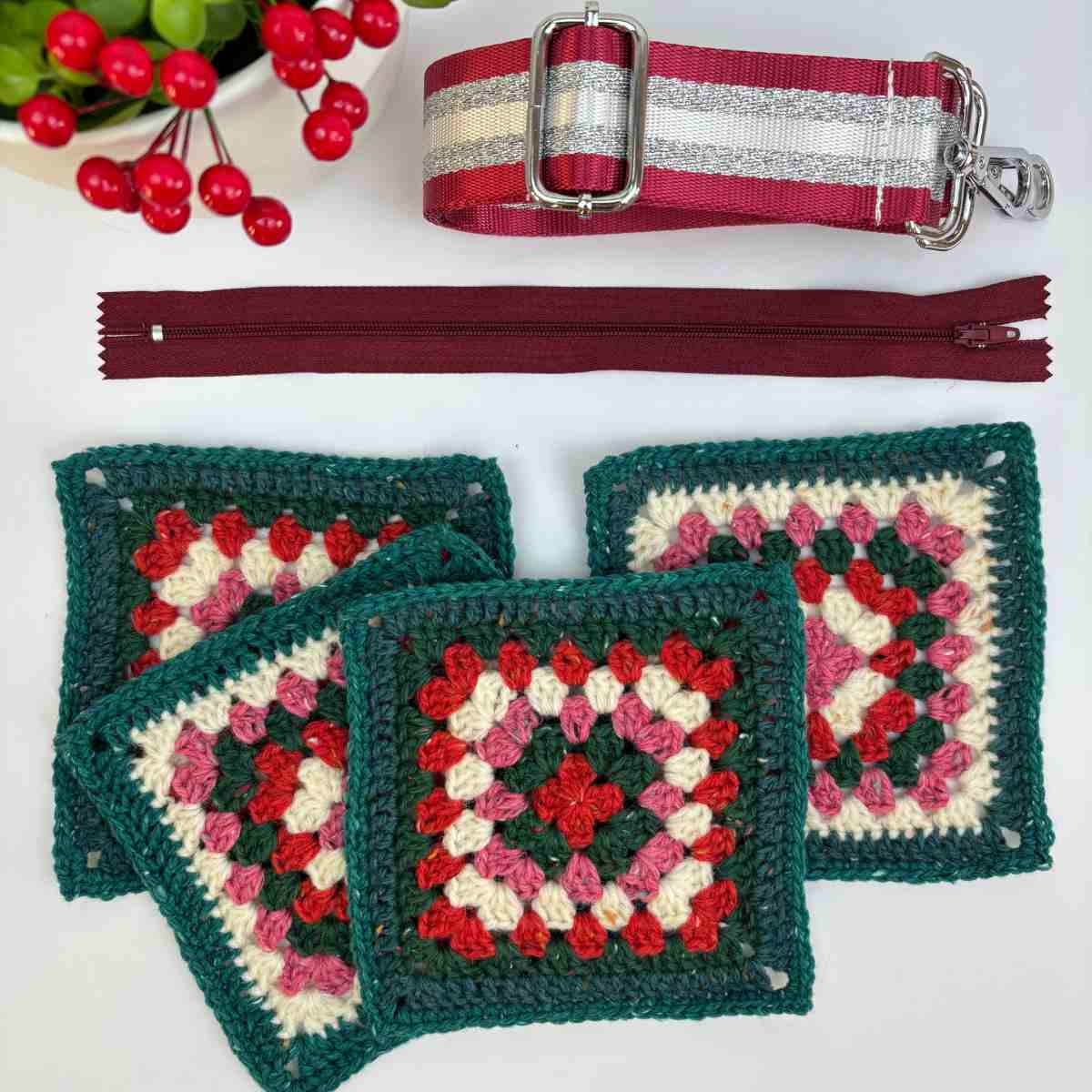 Crochet Granny Square in festive colours ready to make crochet crossbody bag from free pattern.