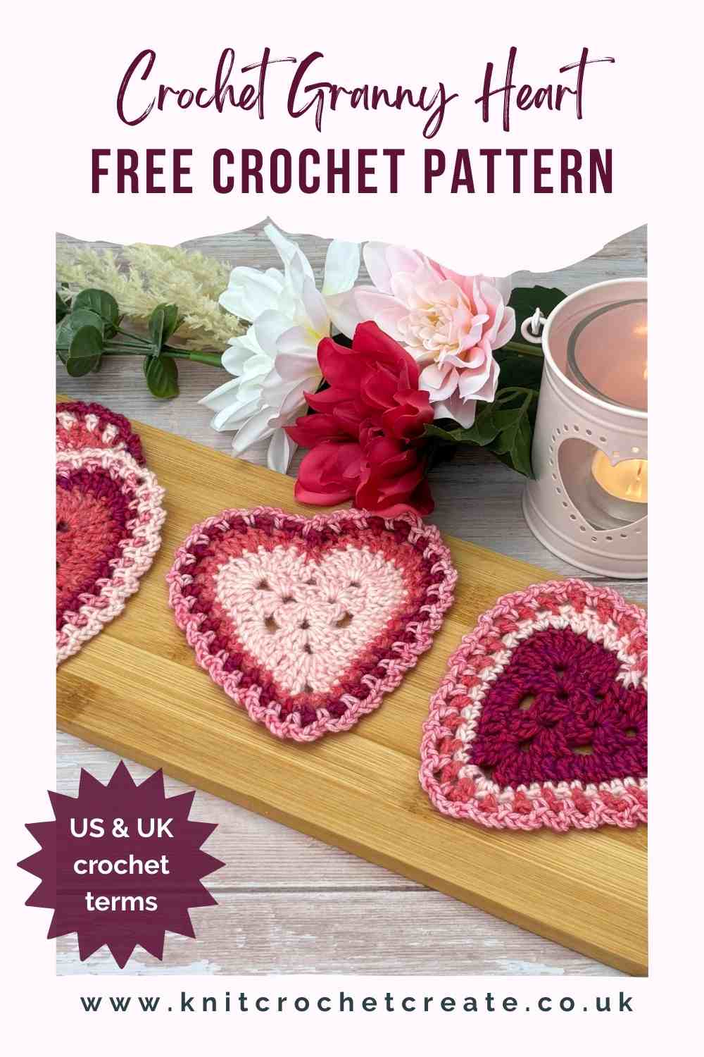 Granny Heart Crochet Coaster shown in pinks, with flowers and a candle for a cosy feel.