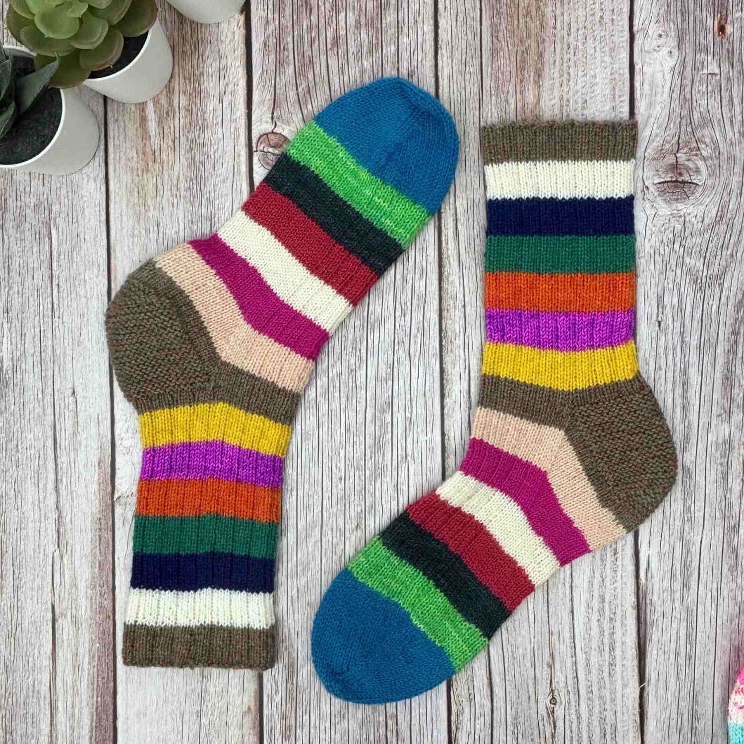 Knitted socks showing in colourful stripes