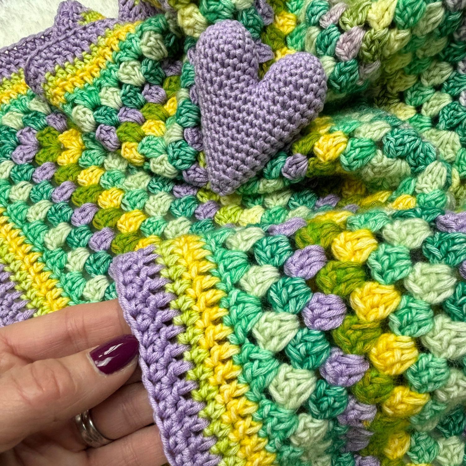 Amigurui heart in lilac. made from leftover year from a stash blanket.