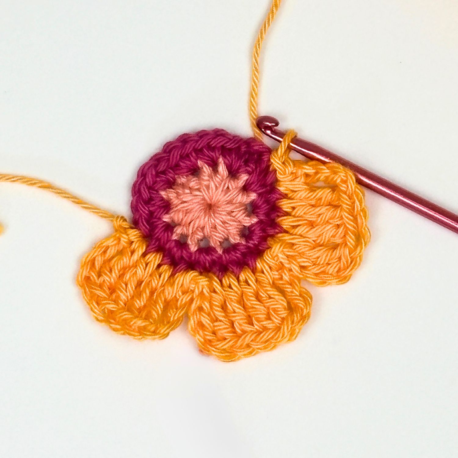 part-made crochet flower showing 3 petals made