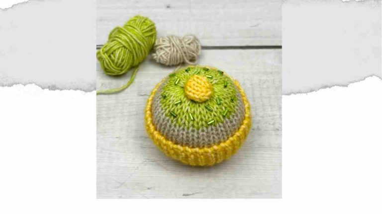 Knitted Cake with a yellow cupcake case and green sprinkles
