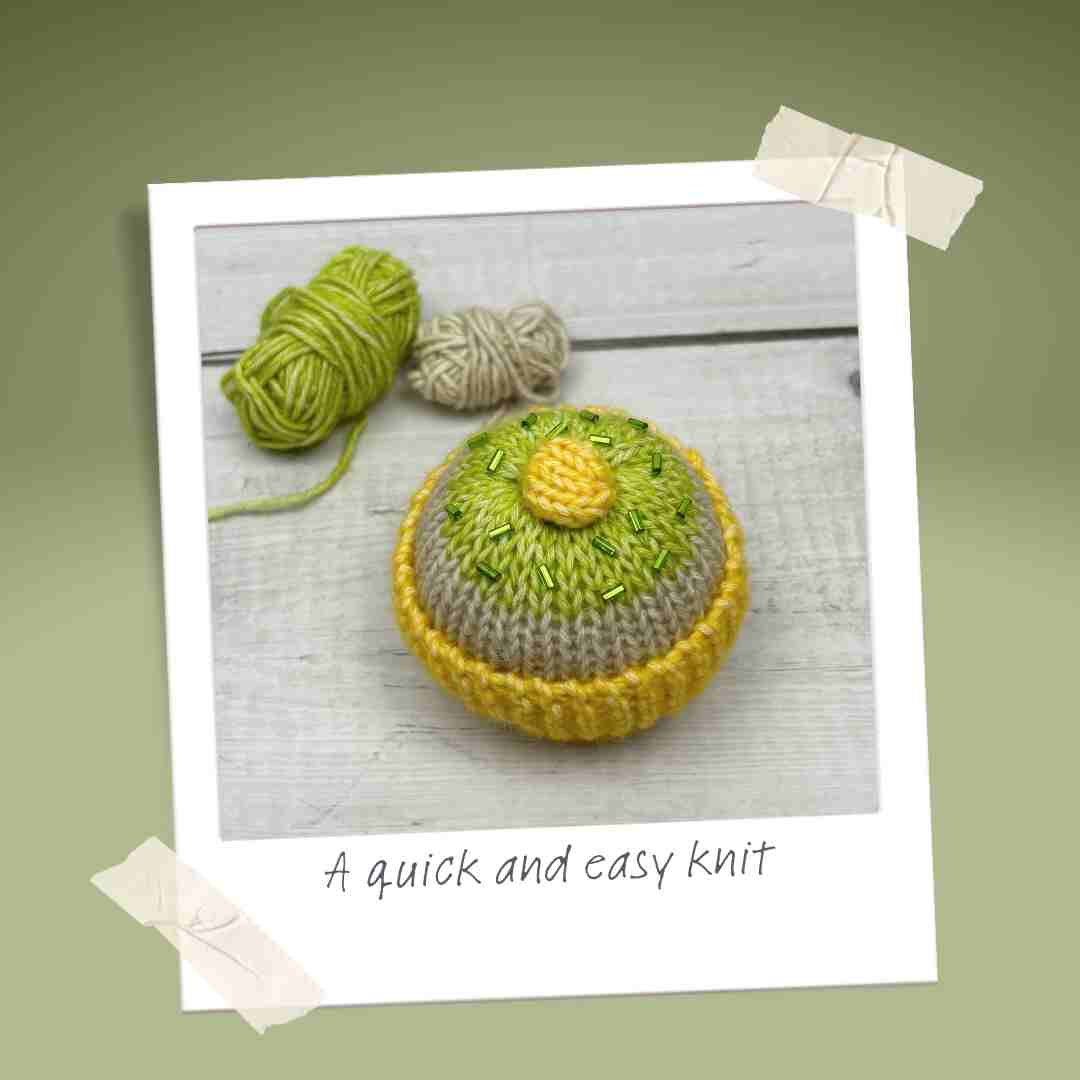 Knitted cake made from yarn stash, using yellow and green yarns.