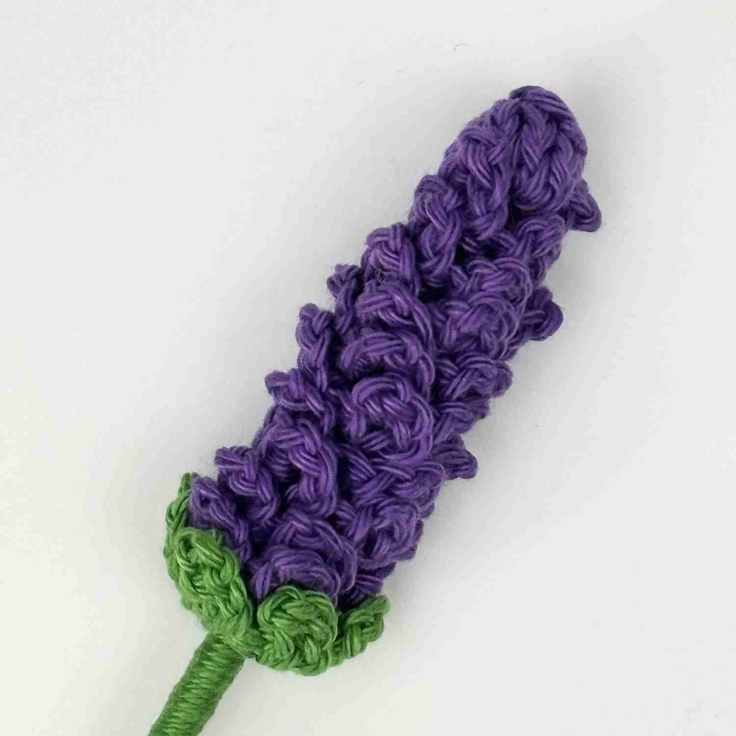 Close up of crochet lavender flower made from free crochet pattern.