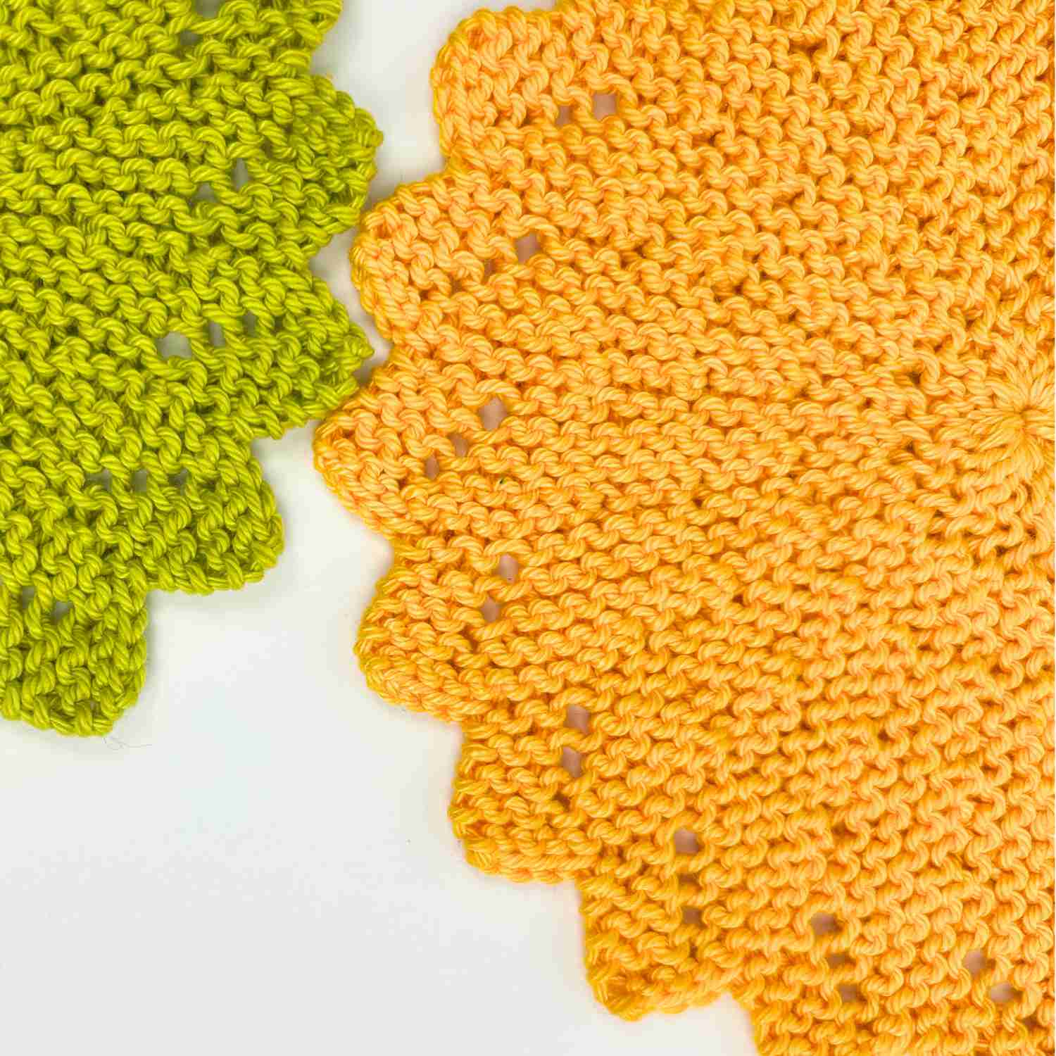 Knitted sunburst circle dishcloth pattern made in bright sunflower yellow yarn and pea green yarn. 