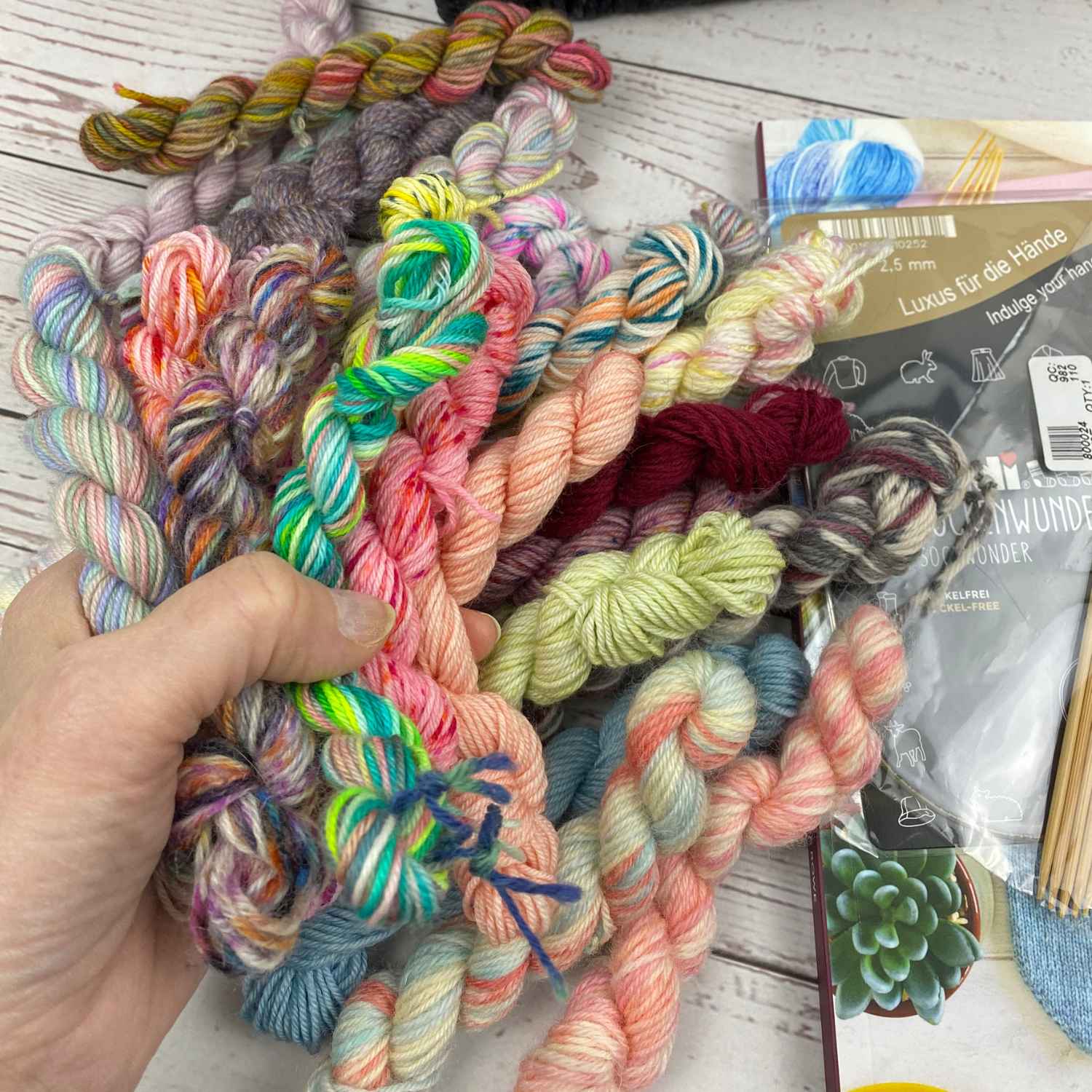 bundle of colourful mini skeins for knitting scrap yarn socks.