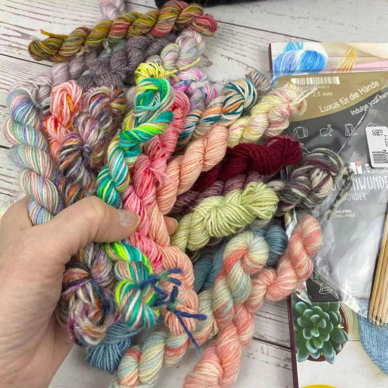 bundle of colourful mini skeins for knitting scrap yarn socks.