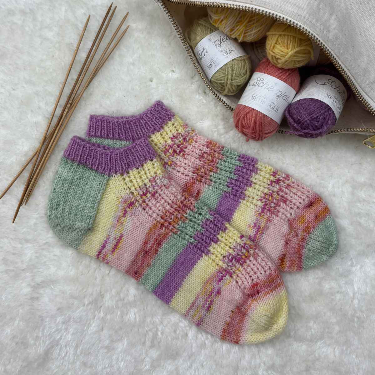 Short ankle socks knitted with yarn stash oddments in pastel shades