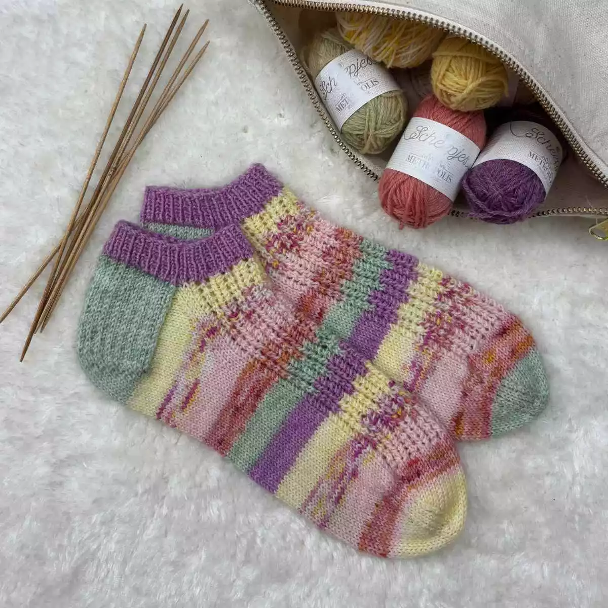 Short ankle socks knitted with yarn stash oddments in pastel shades