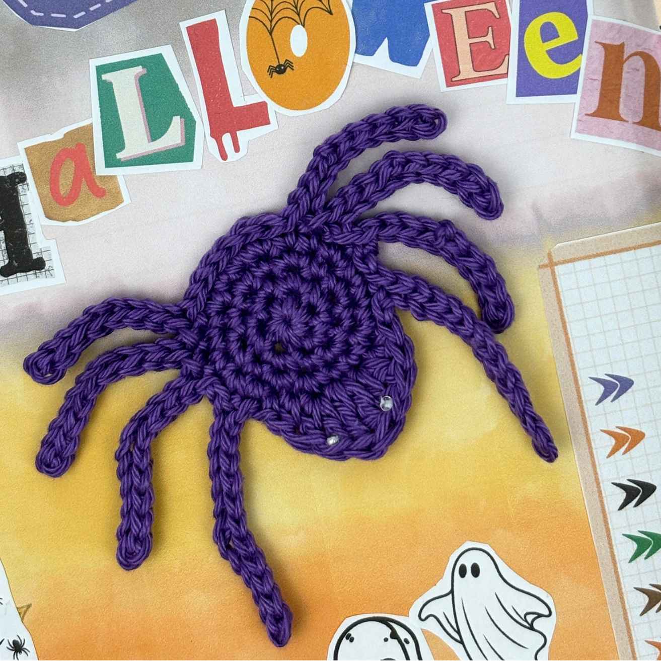Crochet Spider Appliqué Motif made from free crochet pattern, shown in Purple cotton yarn on a crochet journal page.