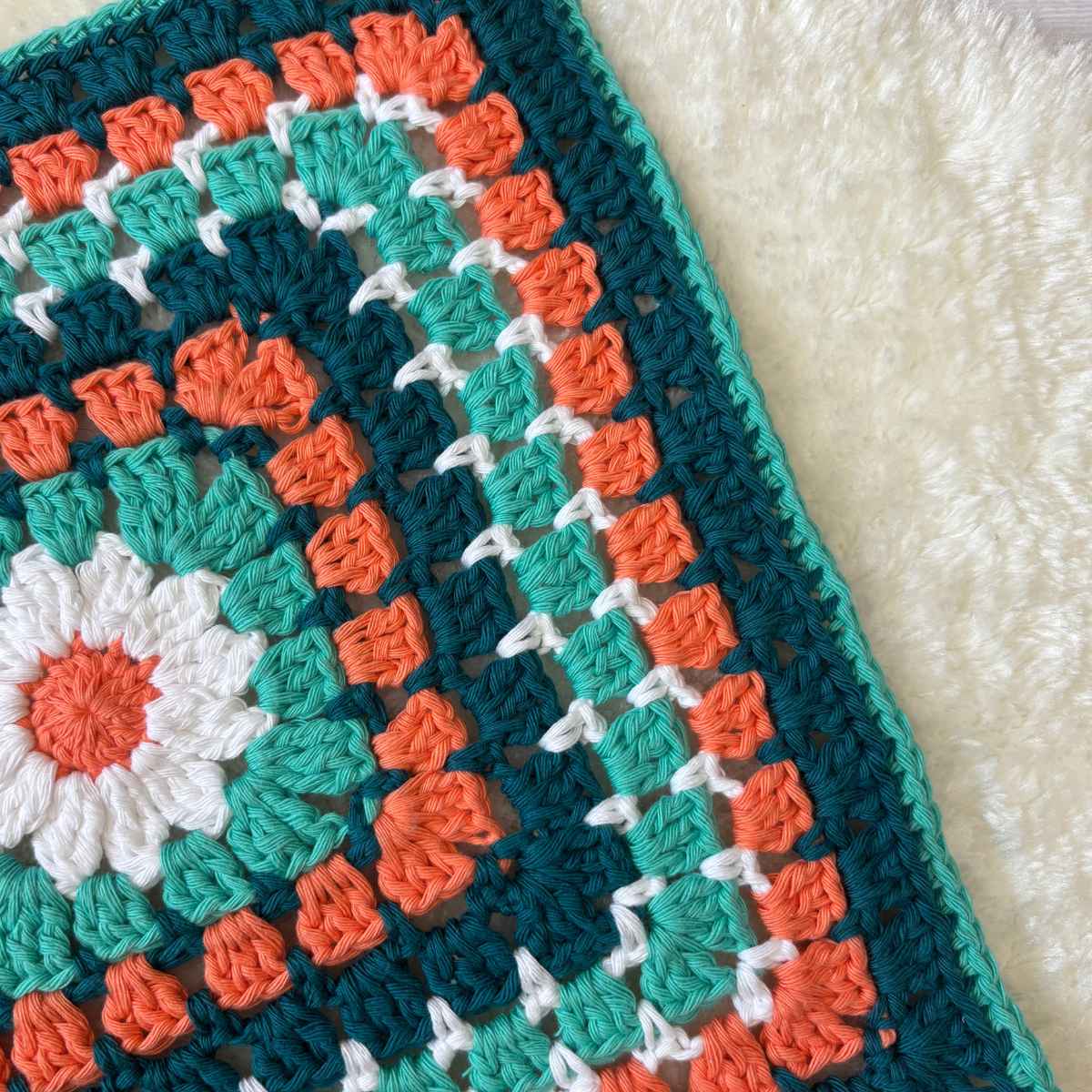 Close up of Daisy Granny Square Centre, made from yarn stash.
